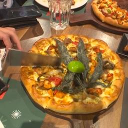 Video | Thais fastfoodrestaurant serveert pizza met cannabis
