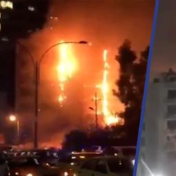 Video | Vlammen slaan uit hotel in Irak